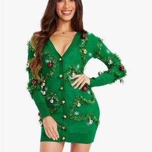 Tipsy Elves Green Holiday Dress with jingle bells.